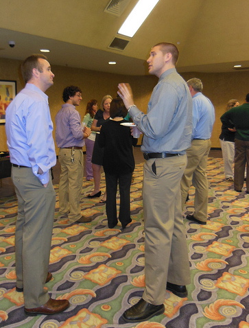 Higher Education Leadership student talking with a VSU HESA professional.