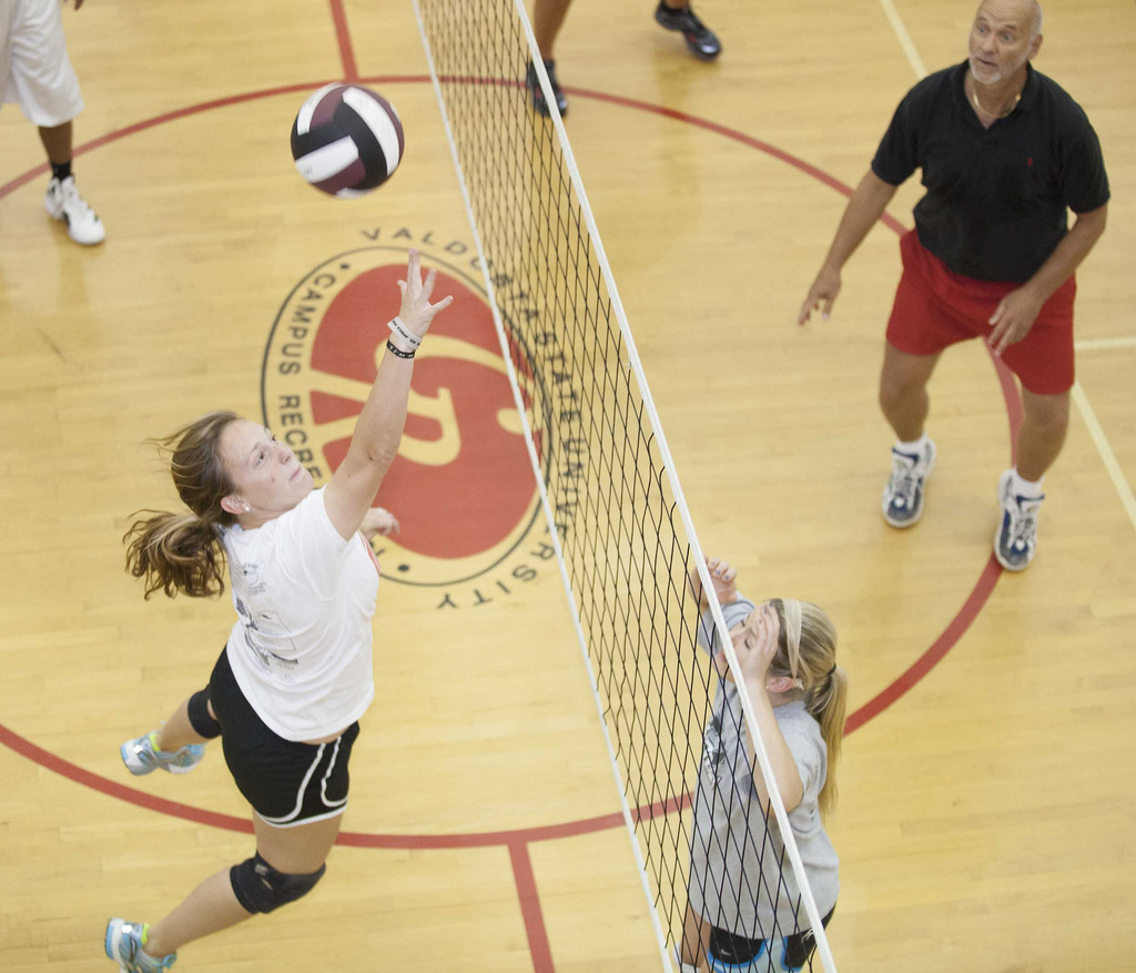 Students play volleyball